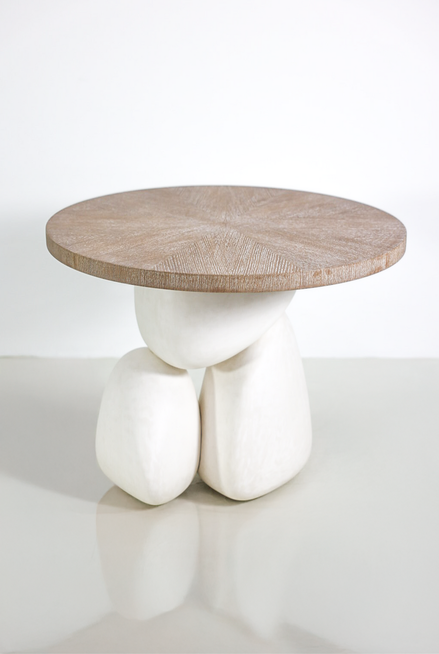 Modern sculptural woo side table with plastered organic base.