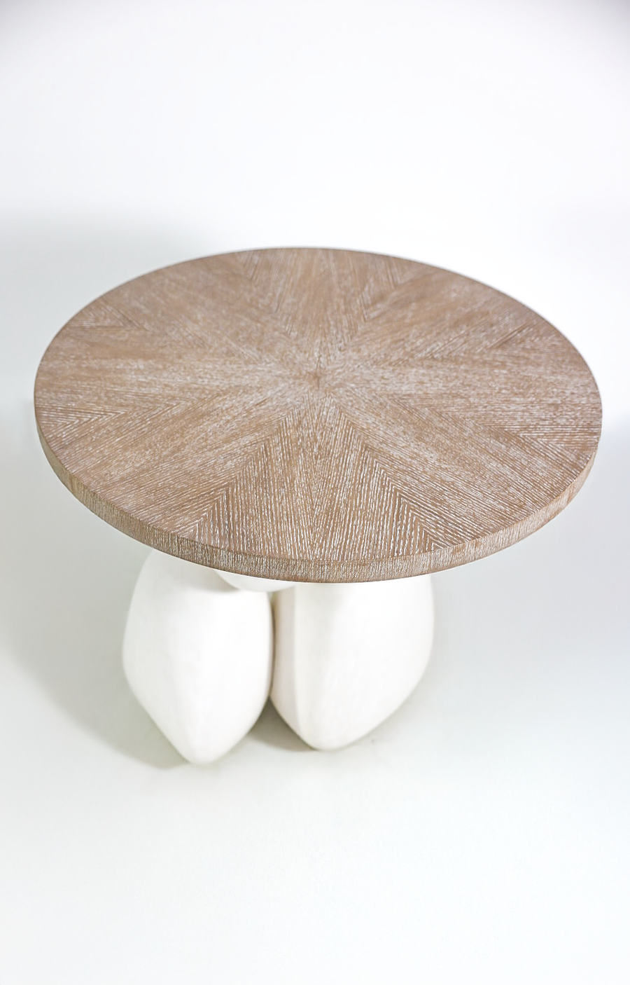 Modern sculptural woo side table with plastered organic base.
