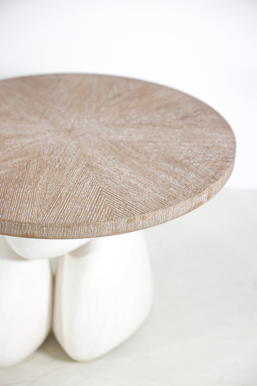 Modern sculptural woo side table with plastered organic base.